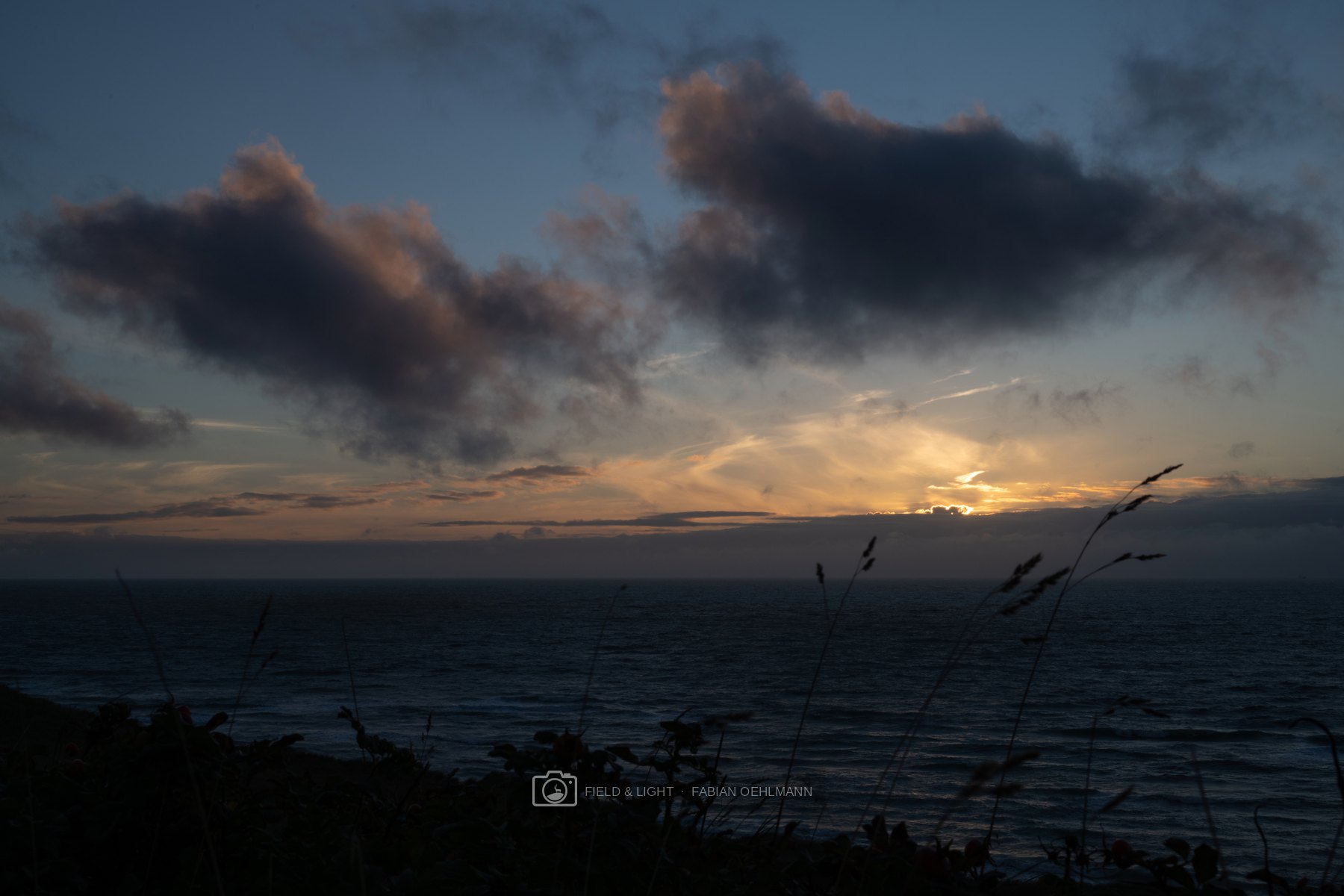 The last sunlight breaking through clouds above the North Sea near Hirtshals